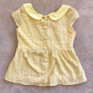 top in very fresh color; buttons at the back.